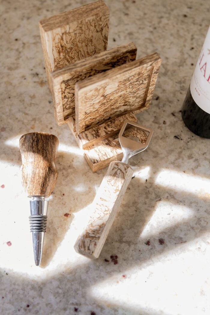 coasters on counter with bottle stopper and hemp wood opener